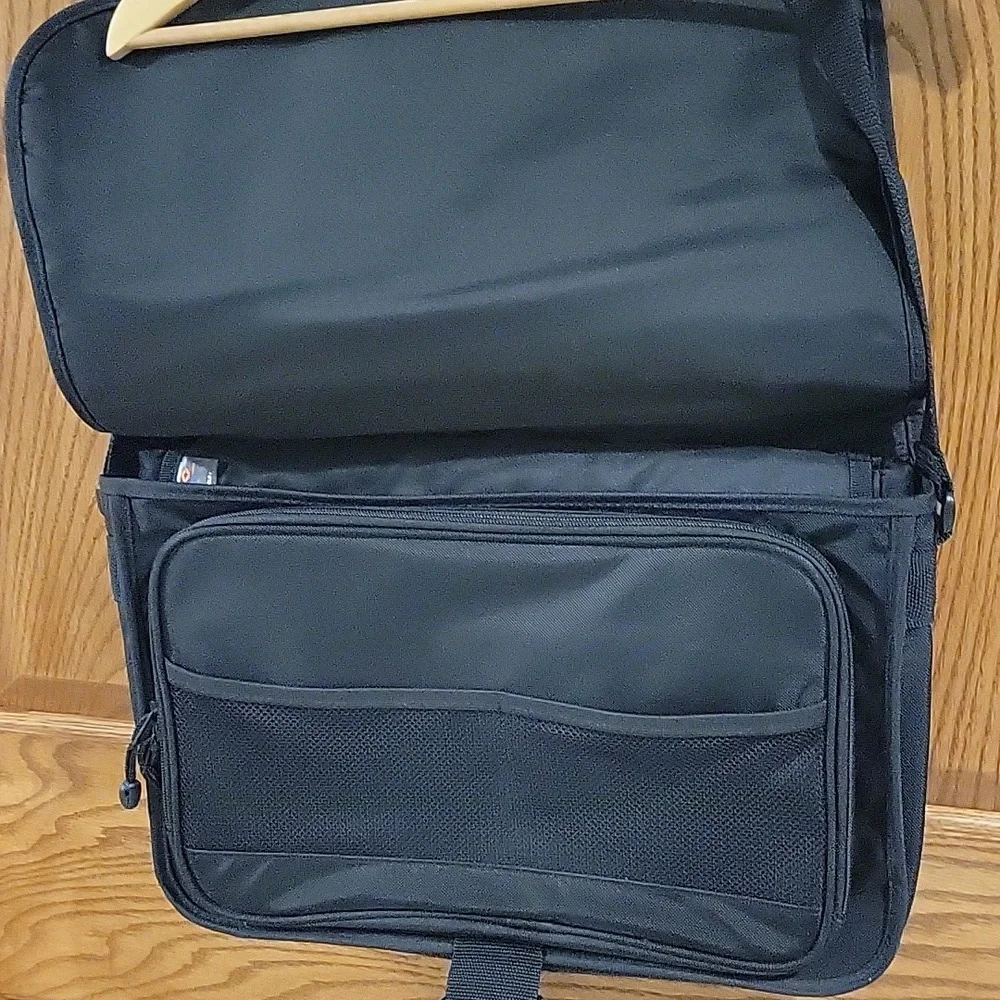 Solo black briefcase with a pullout sleeve for your laptop in black.